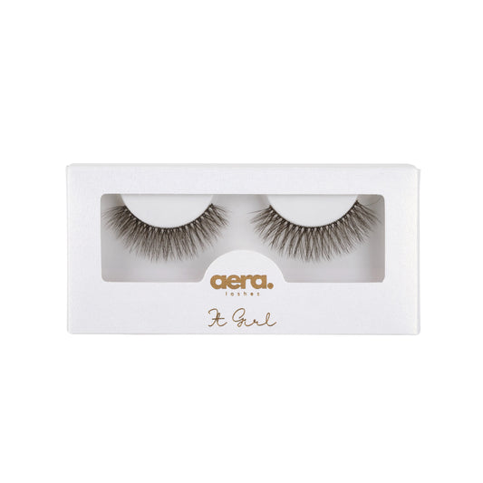 Brunette lash strip named It Girl by Aera Lashes styled for summer with soft, natural curl — perfect for a no-makeup makeup look and sunkissed glow