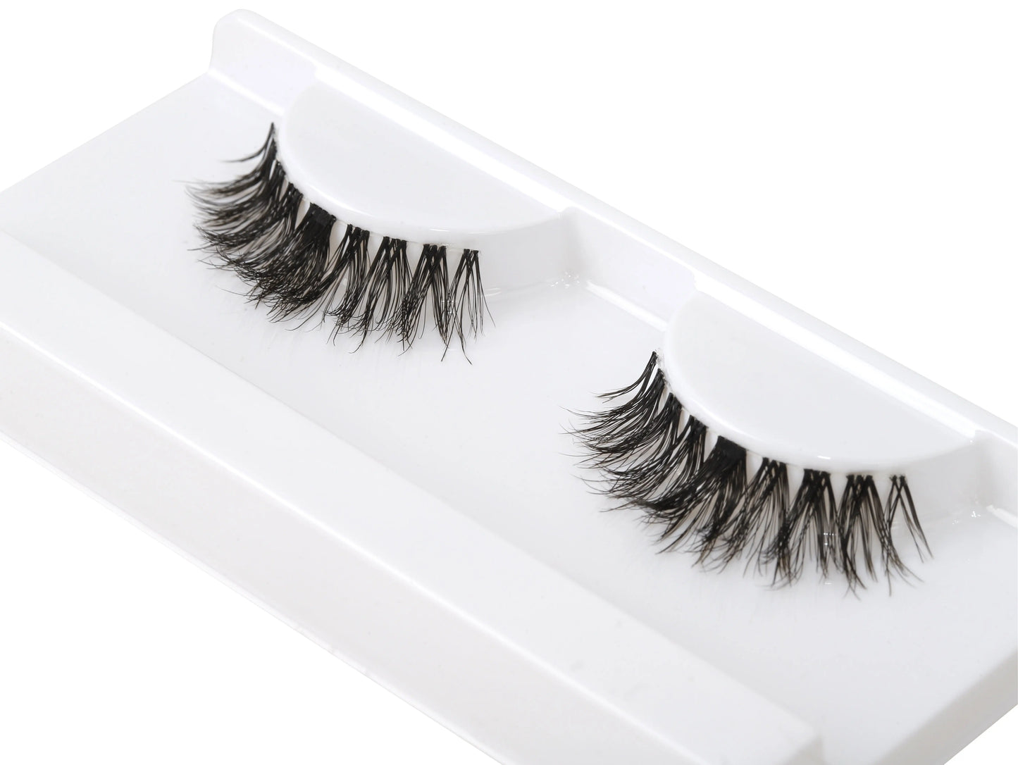 How to apply Girl Next Door lash clusters using black lash glue – at-home eyelash extension tutorial featuring natural doll-eye lash style.
