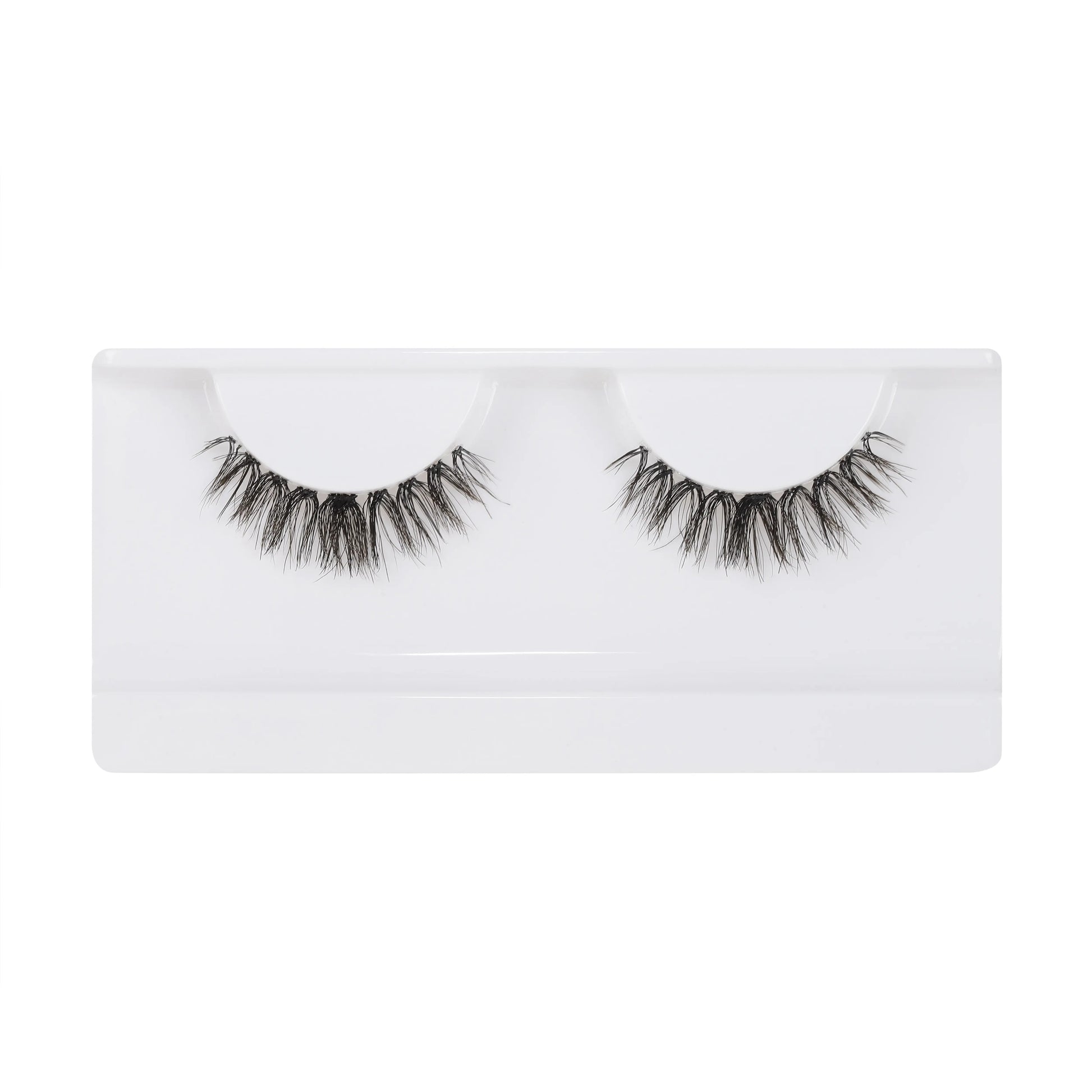 Model wearing Girl Next Door falsies – natural cat-eye wispy lash clusters, waterproof underlash DIY eyelash extensions for everyday wear.