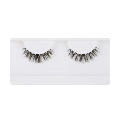 Model wearing Girl Next Door falsies – natural cat-eye wispy lash clusters, waterproof underlash DIY eyelash extensions for everyday wear.
