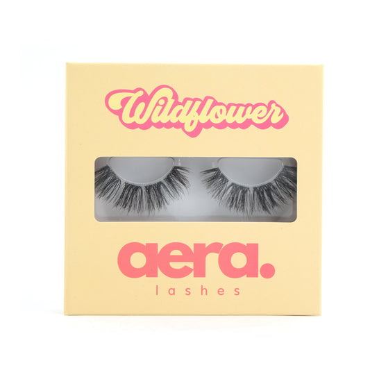 Close-up of Wildflower 12–15mm D curl DIY lash clusters. Mega volume wispy lashes with doll-eye shape for natural glam eyelash extension look.